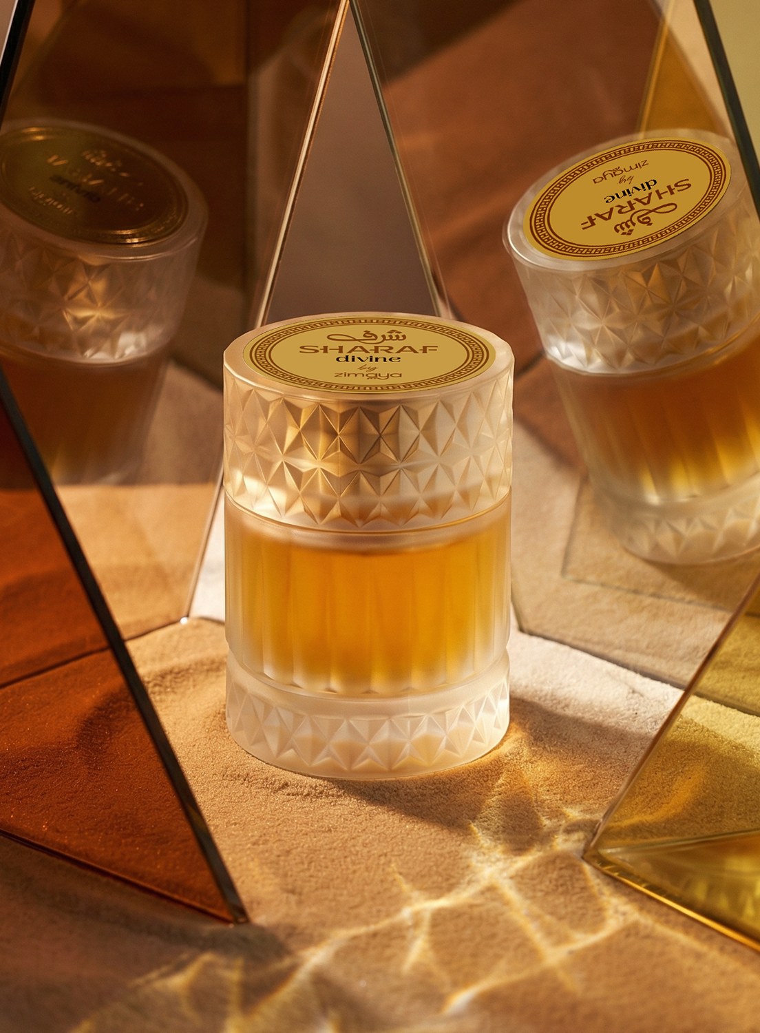 Sharaf Divine amber perfume bottles reflected in warm gold mirrors — AI perfume imagery by The Media Lab.