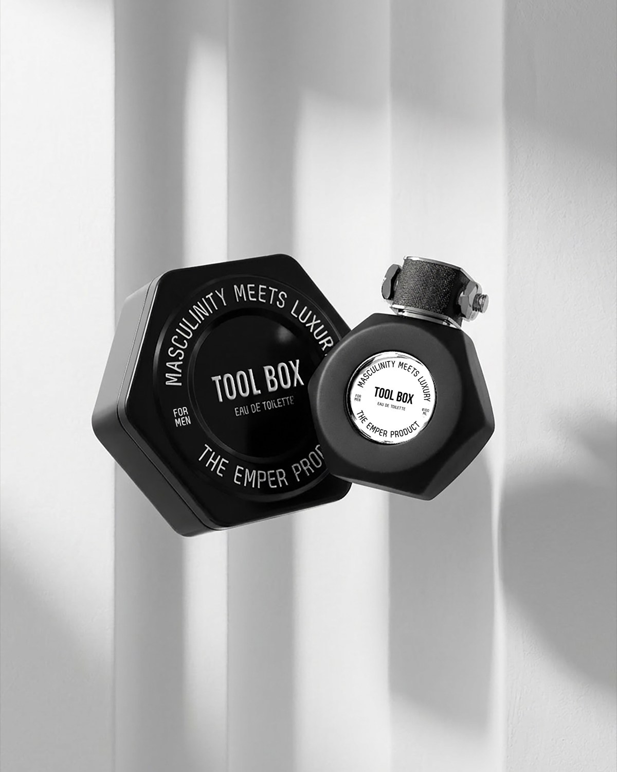 Black and silver Emper Tool Box perfume bottles in soft monochrome light — AI perfume imagery by The Media Lab.
